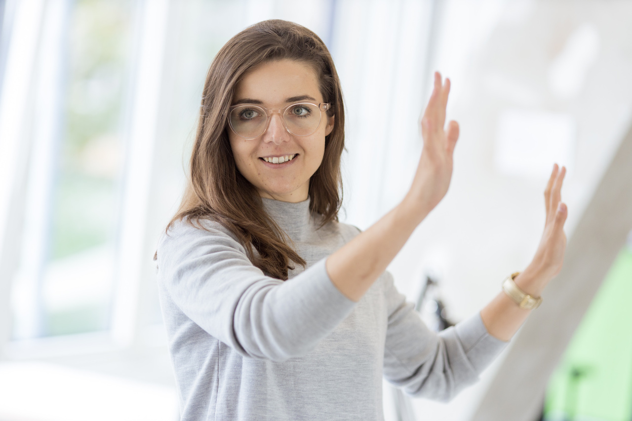 Magdalena gestures.