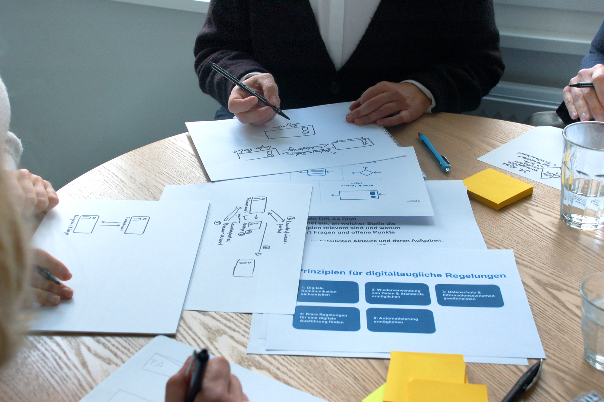 Legists work on a visualization at their desks.