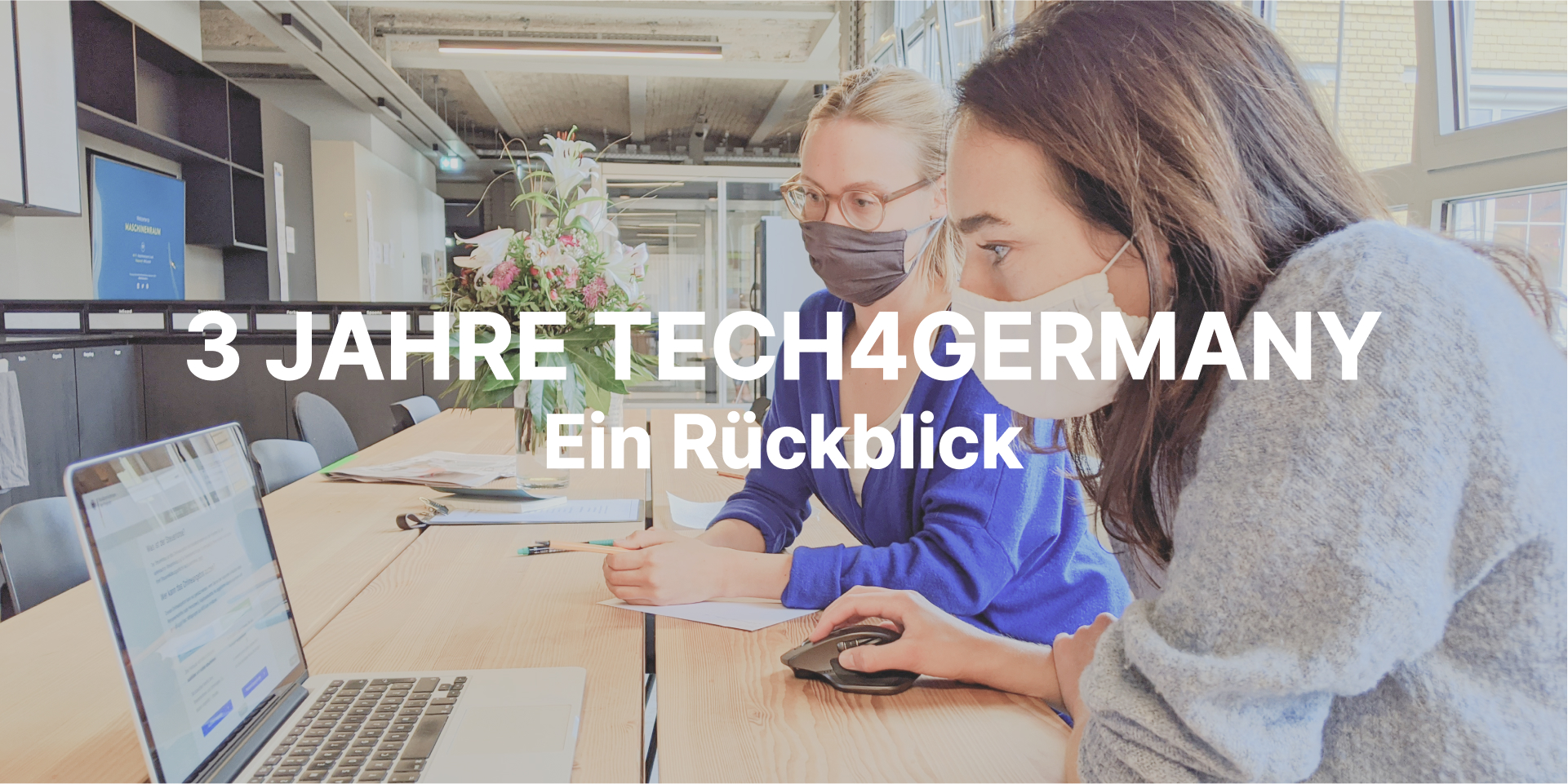 Two employees at work for Tech4Germany.