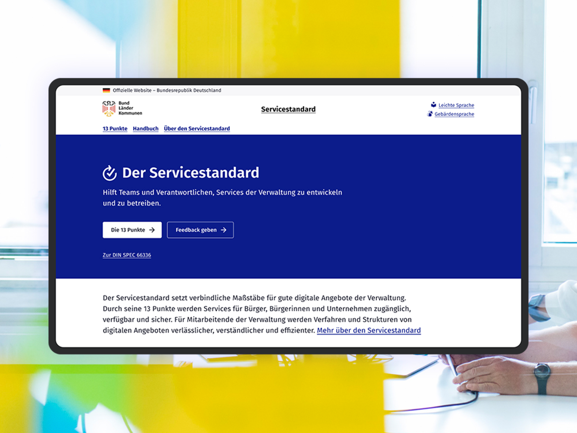 A screenshot of the current beta version of the service standard website; as a visual stylistic device, the DigitalService office can be seen in the background.